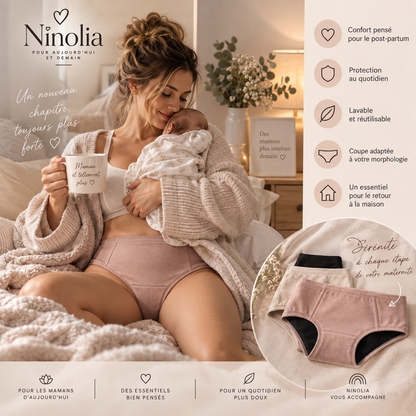 Jeune maman assise tenant son nouveau-né et portant la culotte absorbante post-partum Sérénité Ninolia 